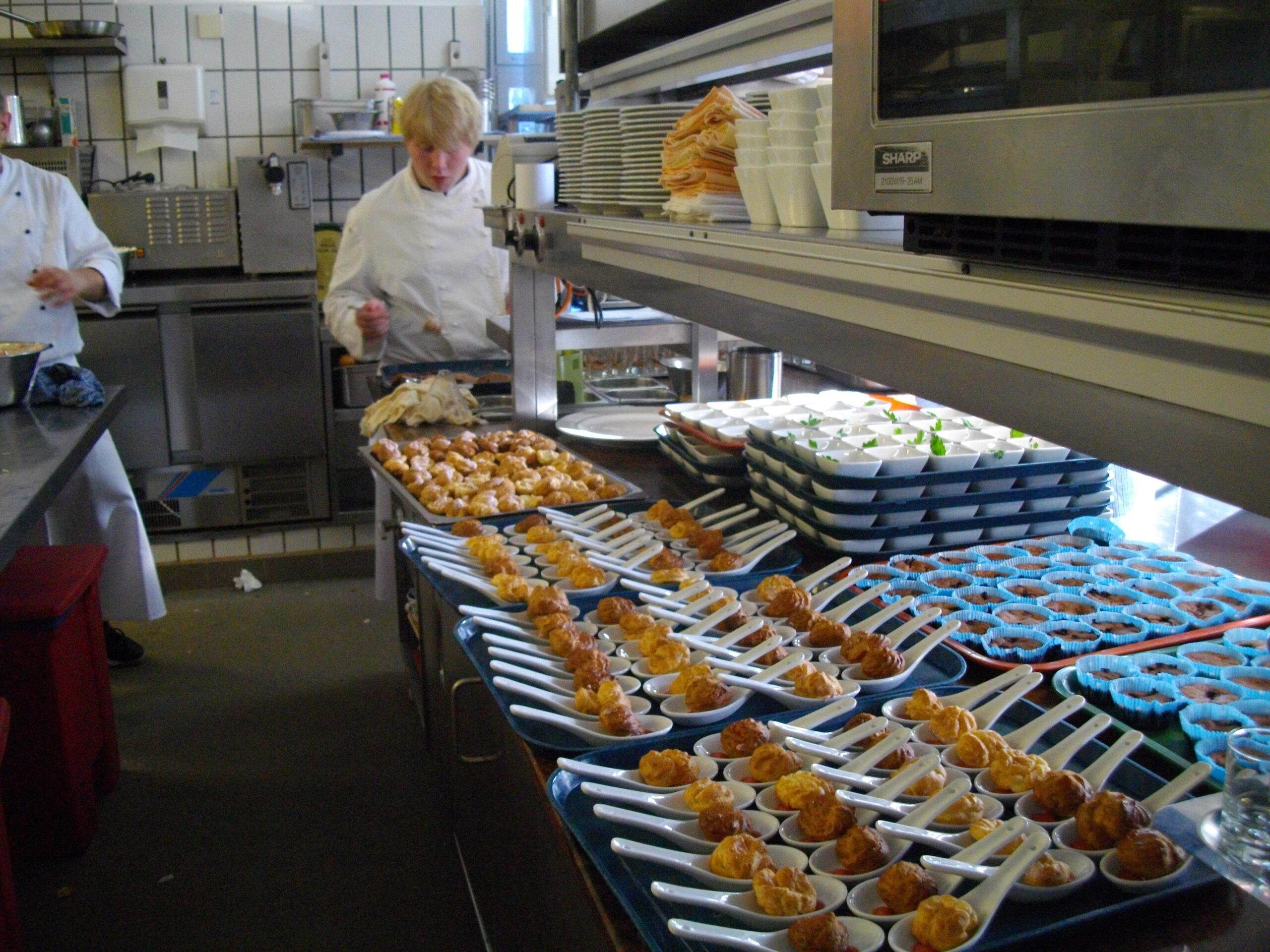 Image of a commercial kitchen preparing food.